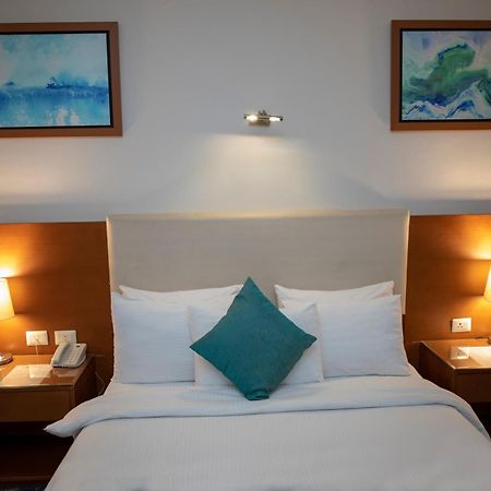 Rehana Plaza Hotel El El Cairo Exterior foto A bedroom at the hotel