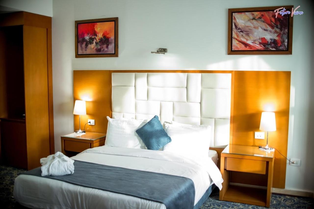Rehana Plaza Hotel El El Cairo Exterior foto A bedroom at the hotel
