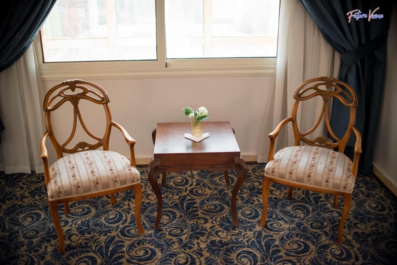 Rehana Plaza Hotel El El Cairo Exterior foto A pair of armchairs